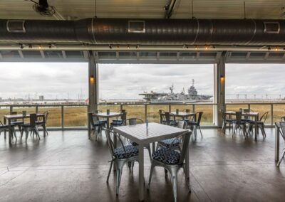 Charleston Harbor and USS Yorktown from the indoor/outdoor dining room at the Fish House Restaurant at Charleston Harbor Resort and Marina.